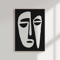 a black and white painting on a wall with a window in the backround