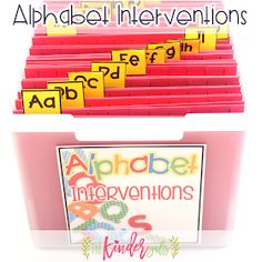 there is a pink bin with lots of letters in it and the words alphabet intervals