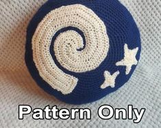 a crocheted blue and white ball with stars on it that says pattern only