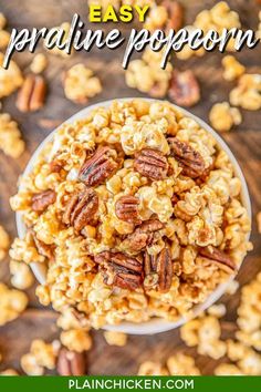 a bowl filled with nuts on top of a wooden table