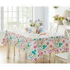 the table cloth is decorated with colorful flowers