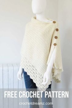 a white crochet ponchy with buttons on the front and back, sitting on top of a mannequin