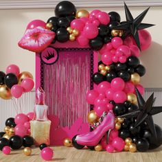 a pink and black birthday party with balloons, lipstick, high heel shoes and decorations