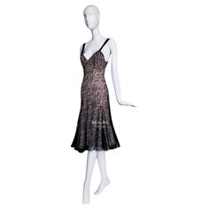 In a seamless blend of timeless elegance and contemporary allure, this 2000s John Galliano dress exemplifies beauty at its finest. Crafted with a meticulous attention to detail, the dress showcases a delicate black lace overlay, which cascades gracefully over a soft blush-toned underlay. This sophisticated interplay of textures creates a mesmerizing visual effect, embodying the ethereal and avant-garde spirit Galliano is celebrated for. The bodice, featuring a flattering sweetheart neckline, is held up by slim black straps, offering both support and a touch of understated sensuality. As the dress cinches at the waist, it accentuates the wearer's silhouette before flaring out into a soft fluted hem. This fluid movement is further enhanced by strategic pleating and godet inserts, which ensur John Galliano Dress, Blush Evening Dress, Galliano Dress, Fluid Movement, Beautiful Lace Dresses, Nude Dress, Dior Haute Couture, Cute Lazy Outfits, Anna Wintour