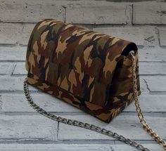 "It will be hard to disguise what great style you have when wearing this camouflage bag Free fabric samples can be despatched, if required please do not hesitate to contact us via the 'contact the seller link' Dimensions of bag -------------------------- Width: 7.8 inches / 20 centimetres Height: 4.7 inches / 12 centimetres Depth: 4.3 inches / 11 centimetres How to order ------------------ Order with any one of the following  A gold 40cm removable chain A silver 40cm removable chain Or simply wi Army Print, Military Camouflage, Confident Woman, Printed Bags, Free Bag, Chain Strap, Green And Brown, Cross Body Handbags, Mini Bag