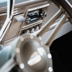 the interior of a car with chrome trim