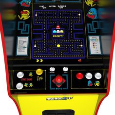 the pac - man arcade machine is shown in this image, it's red and yellow