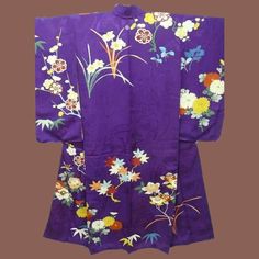 "Deep Purple Antique Japanese Silk Furisode Kimono c1900 Meiji era. Beautifully embroidered with flowers and trees and embellished with gold hand painted detail, the deep purple pure silk crepe background has a self pattern of wheels. The flowers are Chrysanthemums (Kiku), Citrus (Tachibana), Peonies (Botan), Maple leaves (Momiji) and (most unusual) Daffodils! In divine shades of peach, white, yellow, orange, rust, green, black, red and blue. The beautiful floral design is a mix of embroidery an Luxury Purple Silk Kimono, Traditional Floral Print Kimono For Tea Ceremony, Traditional Embroidered Kimono For Tea Ceremony, Yellow Kimono, Furisode Kimono, Meiji Era, Wedding Kimono, Shades Of Peach, Japanese Samurai