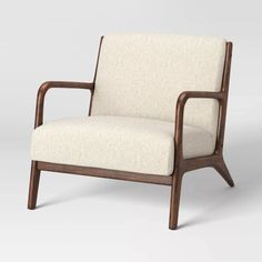 a white chair with wooden arms and legs