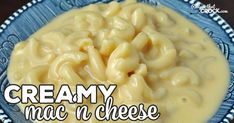 creamy mac n cheese in a blue and white bowl with the words creamy mac n cheese above it