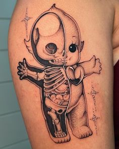 a black and white tattoo of a skeleton bear holding a teddy bear in it's arms