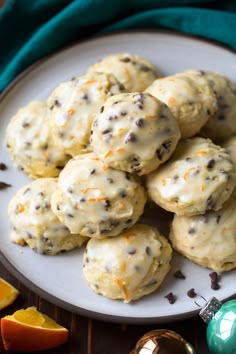 a white plate topped with cookies and orange slices