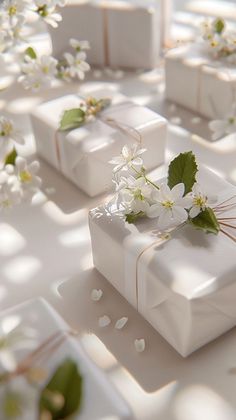 white gift boxes with flowers and leaves on them