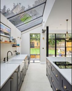 a large kitchen with an open skylight above it