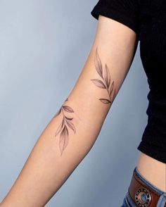 a woman with a tattoo on her arm