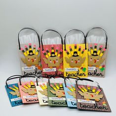 several bags with different designs on them and tags attached to the handles that say teacher's day