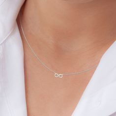 "Symbolising eternity, purity and everlasting love, this silver infinity necklace from Little Silver is the perfect way to commemorate a special milestone in your friendship. Hand-crafted in genuine 925 sterling silver, each looping pendant floats elegantly from a 16\" (+2inch extender) necklace chain with a spring ring closure. Cubic zirconia pavé settings add a beautiful dimension of sparkle and texture to the appearance of this infinity chain necklace. Elegantly displayed in a gift-ready embossed  box with our brand name \"Little Silver'' in silver foil lettering, this piece makes a thoughtful and timeless necklace gift for women. Present this eternity necklace as an unforgettable gift for her for Christmas, Mother's Day, Birthdays, Anniversaries or \"just because\"." Elegant Silver Necklace For Friendship, Elegant Silver Necklace For Best Friend Gift, Silver Infinity Jewelry For Best Friend Gift, Elegant Heart-shaped Necklace For Friendship, Sterling Silver Infinity Heart Necklace As Gift, Infinity Necklace Silver, Infinity Pendant, Friendship Necklaces, Infinity Necklace