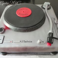 a cake that is shaped like a turntable