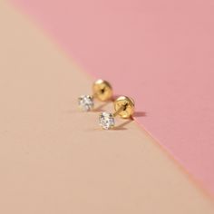 These beautiful four prong set cubic zirconia earrings were crafted in 14k yellow gold, a precious material which is suitable for babies and little girls with sensitive ears. Features a 3mm round cz gems for a sparkly touch in front. High polished for long lasting shininess and durable quality, these classic and timeless earrings for girls come with screw backs which is a safety back that screws on and locks thus preventing for any poking in the back of the earlobe and lessening chances of lost Timeless Earrings, Baby Earrings, Earrings For Girls, Cubic Zirconia Earrings, Zirconia Earrings, Girls Earrings, Sensitive Ears, Girls Shopping, Prong Setting