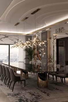 an elegant dining room with chandelier, chairs and large glass table in the middle