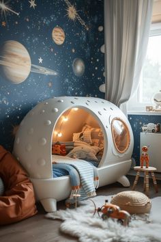 a child's bedroom decorated in space themed decor