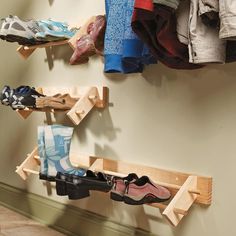 there are many pairs of shoes hanging on the wall next to each other in this shoe rack