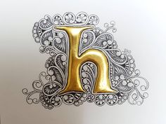 the letter h is drawn in gold and silver with intricate designs on it's sides