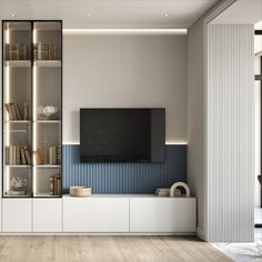 a living room filled with furniture and a flat screen tv on top of a book shelf