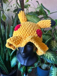 a crocheted pokemon hat sitting on top of a head