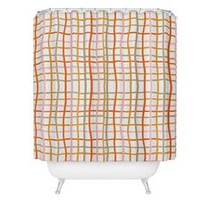 a shower curtain with an orange and white plaid pattern