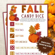 the fall candy dice game is shown with pumpkins and other items on top of it