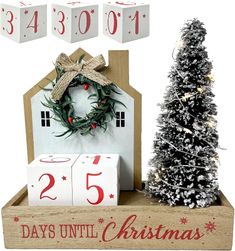 a wooden box with a christmas tree and two blocks that say 25 days until christmas