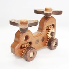 a wooden toy car with gears on it