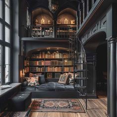 a living room filled with lots of bookshelves next to a couch and window