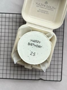 a birthday cake in a box on a table