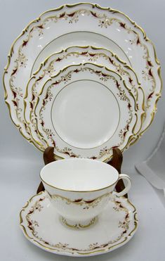 a white and gold china dinner set