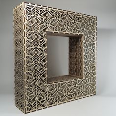 an intricately carved wooden box is shown