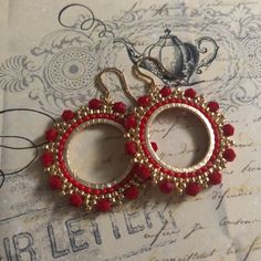 Red Crystal Seed Bead Hoop Earringsp Hoop earrings made with bright red velvety crystals with metallic gold 11/0 beads. The perfect Christmas holiday season earrings. Beautiful red crystals bead woven on a gold plated ring. The french hook earwires and findings are 14kt gold plated. These very lightweight measure 1.75 inches total. The beaded hoops are slightly over 1 inch. Great for anytime. I absolutely love this color and sparkle. Thanks for looking and please stop by again. 8 Elegant Red Earrings With Gold Beads, Red Beaded Earrings For Holiday With Round Beads, Red Faceted Beads Earrings For Festive Occasions, Red Beaded Earrings For Holiday, Handmade Red Beaded Hoop Earrings, Festive Red Beaded Earrings For Pierced Ears, Red Beaded Earrings For Festive Occasion, Festive Red Beaded Pierced Earrings, Elegant Red Beaded Earrings For Christmas