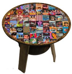 a wooden table topped with lots of pictures and words on it's side legs