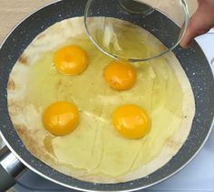 three eggs are being cooked in a pan