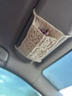 there is a crocheted seat belt in the car