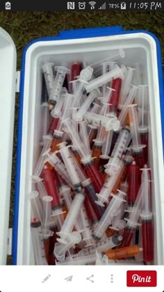 there are many plastic containers filled with different types of toothbrushes and tubes in them