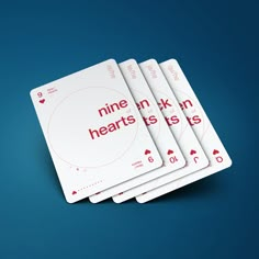 four playing cards with the words nine hearts in red and white on them, stacked up against a blue background