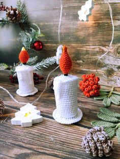 knitted christmas decorations on a wooden table