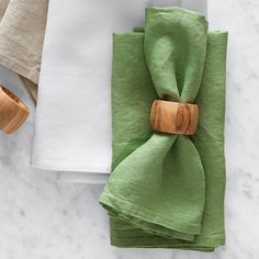 two napkins with wooden rings on them