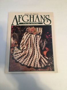 the cover of afghans for all seasons, with an image of a woman's dress