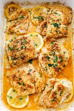 chicken with lemon and parsley in a white casserole