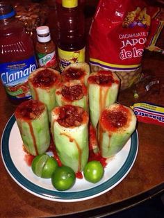 some food is sitting on a plate with ketchup and sauces around it