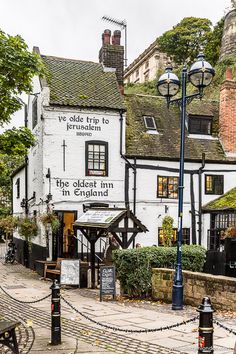 the oldest inn in england is located at the end of an old - fashioned cobblestone street