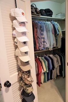 a closet filled with lots of hats and shirts